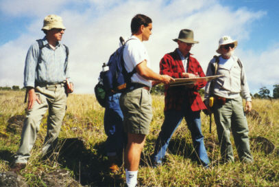 Chris consults the aerial photograph
